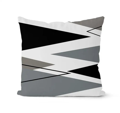 A modern geometric black white pillowcase set featuring a bold zigzag pattern on a square living room cushion