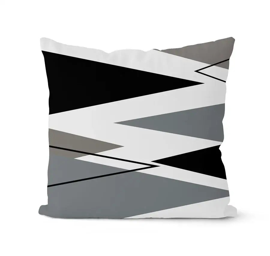 A modern geometric black white pillowcase set featuring a bold zigzag pattern on a square living room cushion
