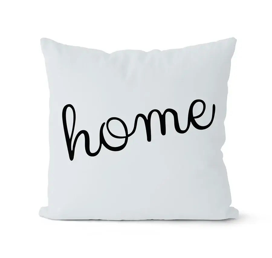 Modern geometric black and white pillowcase set featuring a white throw pillow with home in black cursive script decorbites geometric black