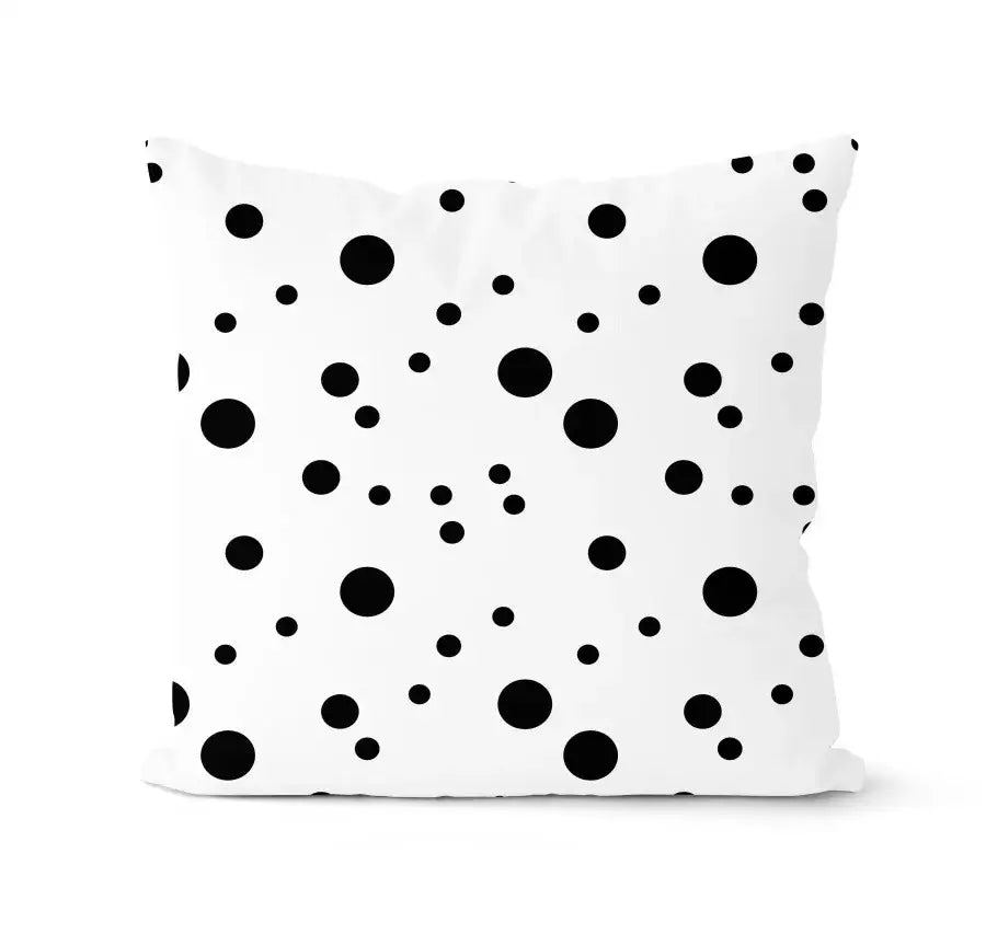 Modern geometric black and white pillowcase set featuring a white throw pillow with playful black polka dot decorbites geometric design