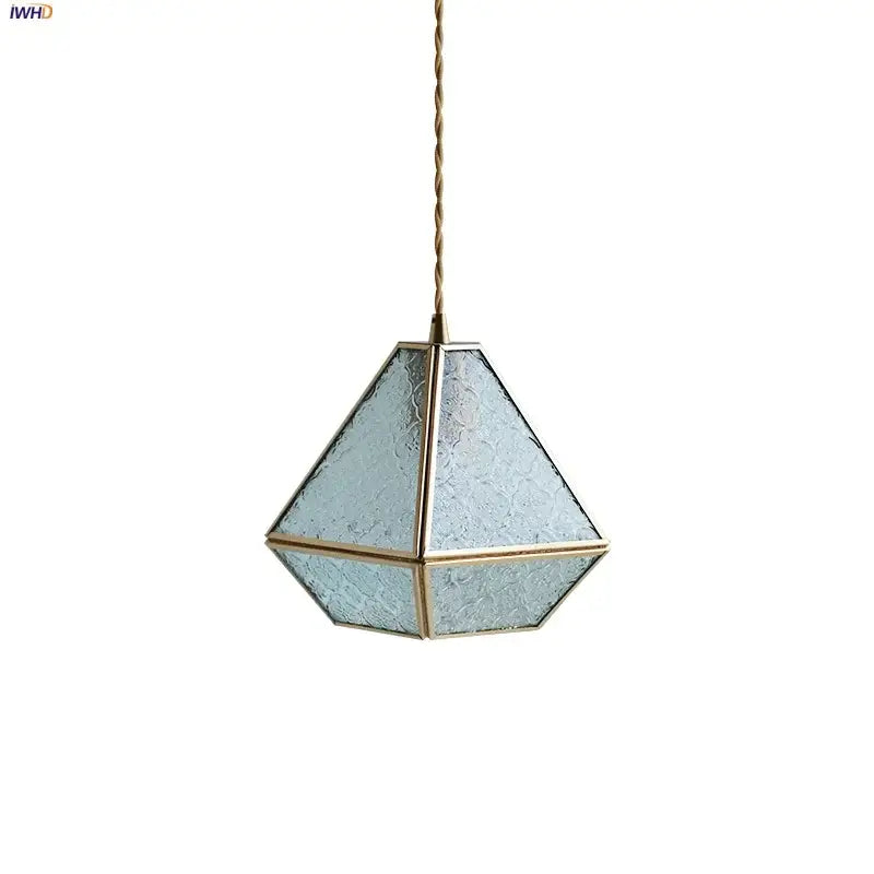 Modern geometric blue glass and brass pendant light with frosted panels suspended by a twisted gold cord for dining room decorbites blue glass
