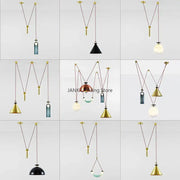 Modern geometric brass and black metal pendant light with glass chandelier shades in conical, spherical, and dome shapes for dining room
