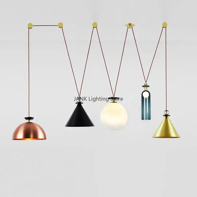 Set of modern adjustable pendant lights with copper black white and gold metallic shades for dining room use