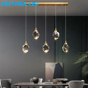 Modern geometric brass diamond crystal led chandelier featuring gold-toned pendant light with minimalist design