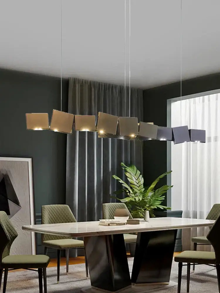 Modern geometric bronze and dark gray box shape pendant light with matte gold accents for dining room decorbites design