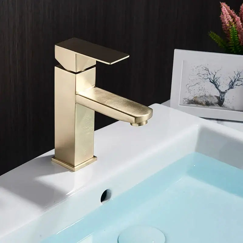 Modern geometric brushed gold basin faucet with sleek design and brushed metal finish for bathroom decorbites style