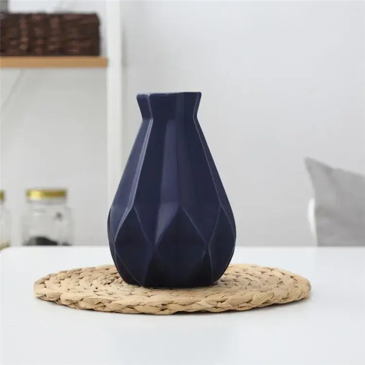 Deep navy blue decorbites ceramic diamond vase with faceted angular design for modern living room decor