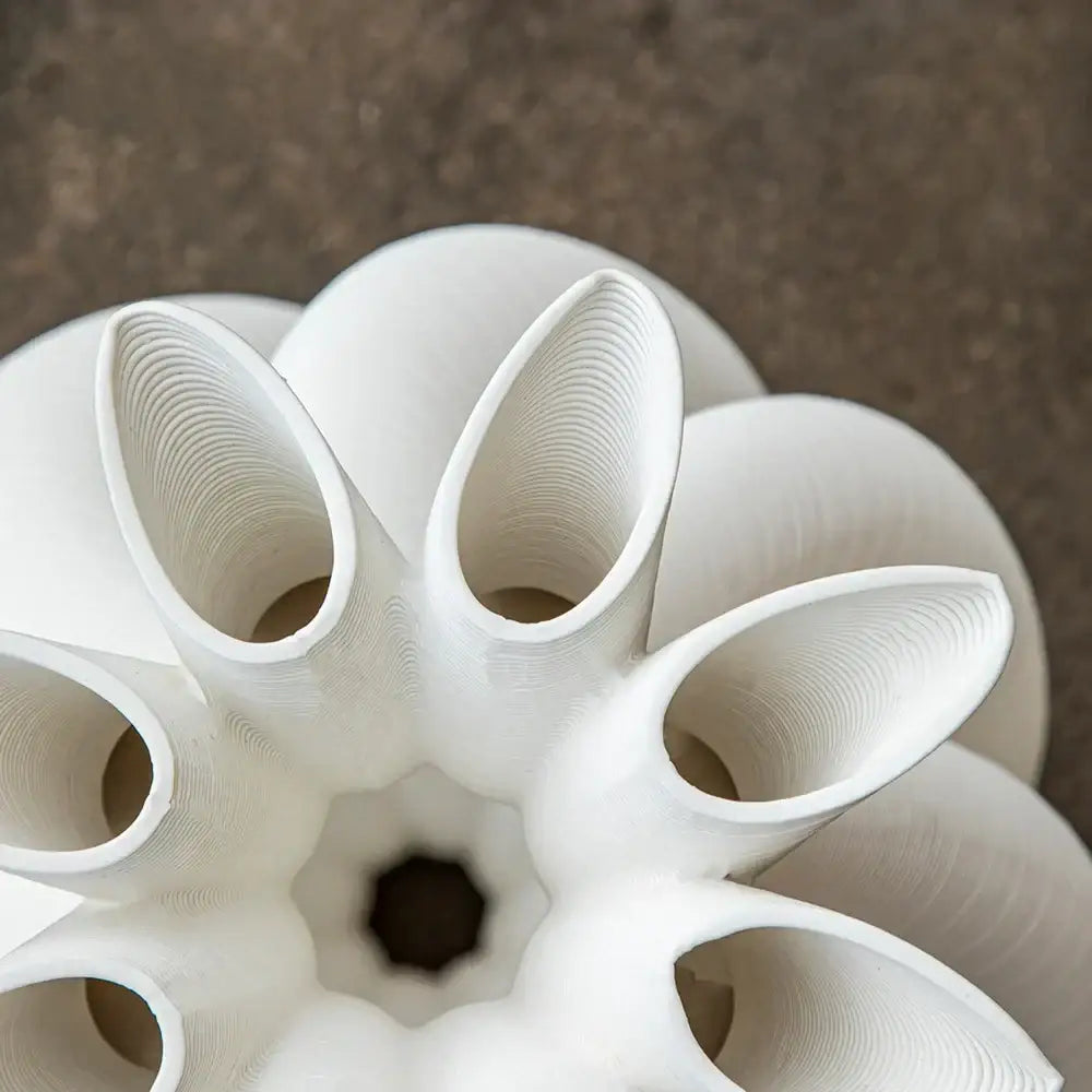 White modern geometric ceramic spiral vase with intricate layered petal design and glossy finish for living room decorbites decor