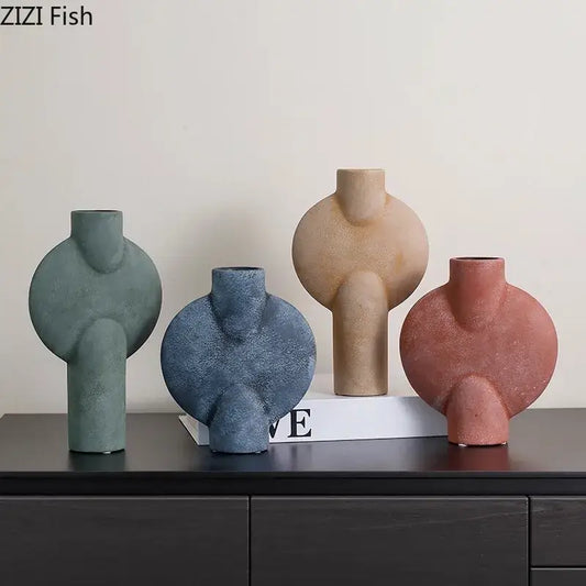 Set of four decorbites geometric ceramic vases in muted green blue beige and terracotta for living room decor