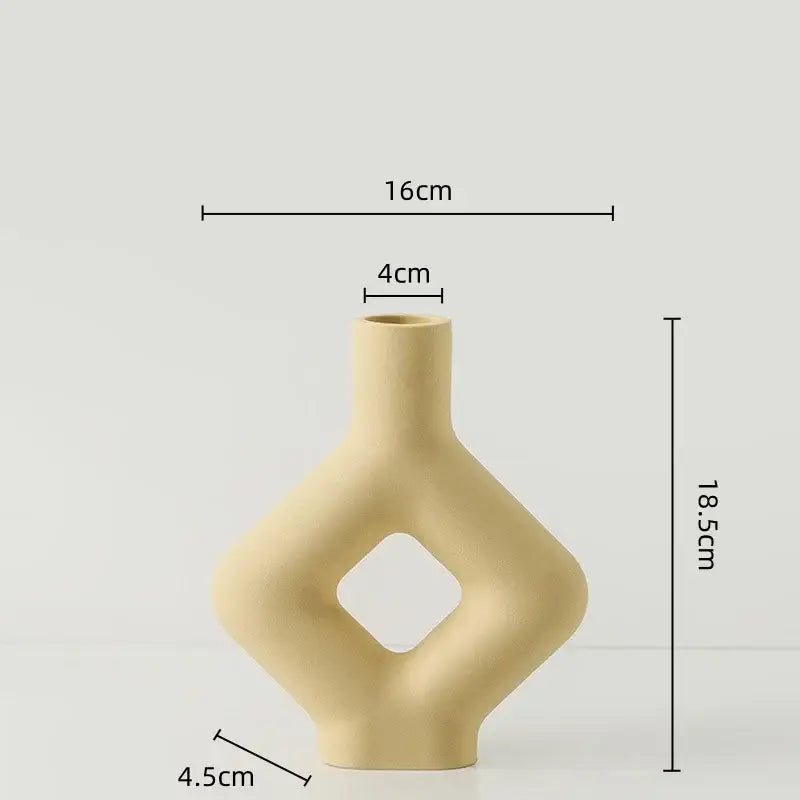 Beige decorbites geometric ceramic vase with diamond cutout and sleek modern contours for living room decor