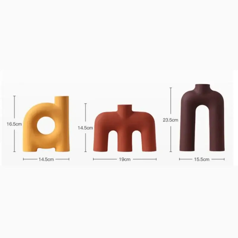 Three decorbites geometric ceramic vases in yellow terracotta and dark brown with smooth matte arch designs for living room decor