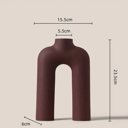 A sleek matte brown decorbites geometric ceramic vase with modern u-shaped design for living room decor