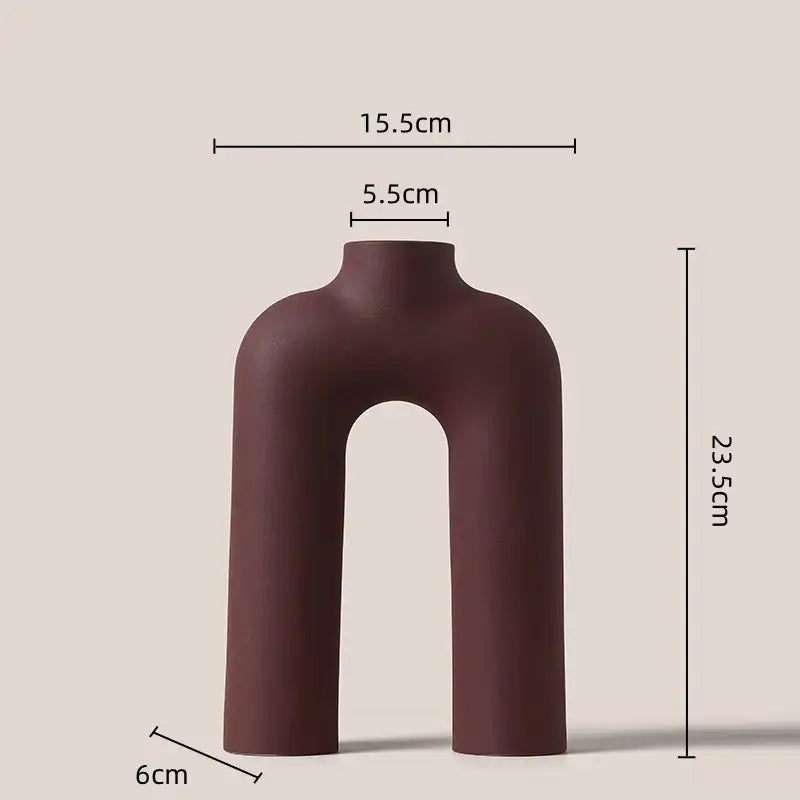 A sleek matte brown decorbites geometric ceramic vase with modern u-shaped design for living room decor
