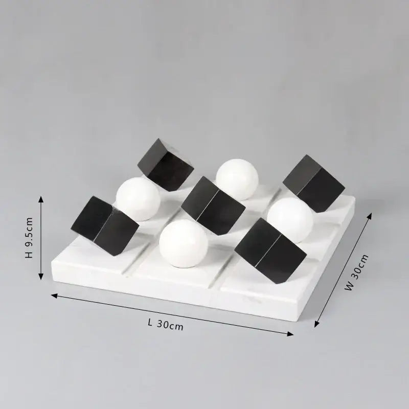 White marble tic-tac-toe board with black and white spherical pieces modern geometric chess ornament set for home decor
