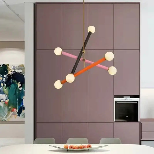 Modern geometric colorful chandelier with black orange and pink rods and white spherical bulbs for dining room decorbites chandelier art deco