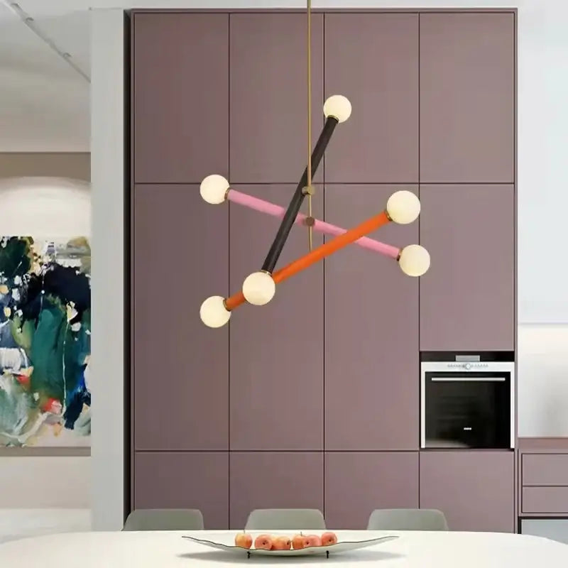 Modern geometric colorful chandelier with black orange and pink rods and white spherical bulbs for dining room decorbites chandelier art deco