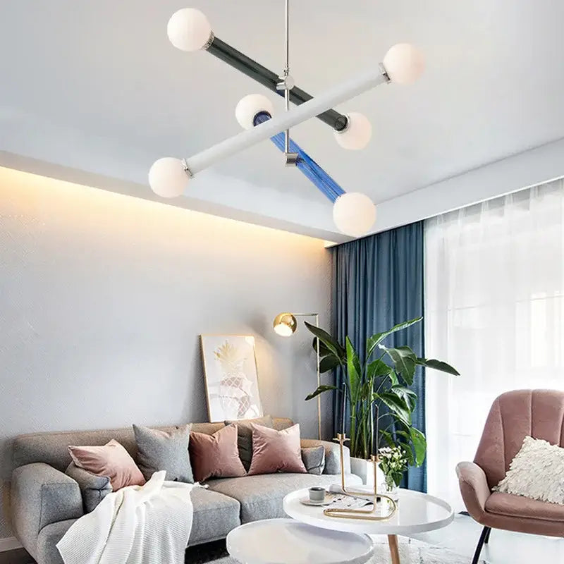 Modern geometric colorful chandelier with white spherical bulbs and black blue silver metallic arms for dining room decorbites colorful chandelier chandelier art deco