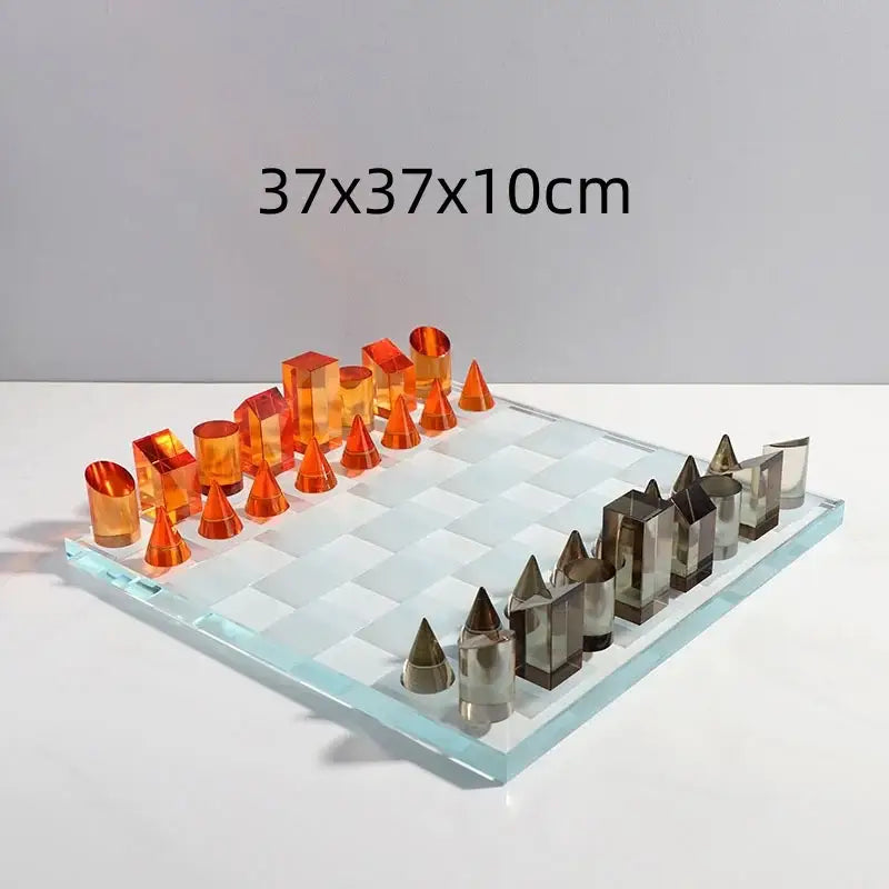 Modern geometric crystal chess set with translucent orange and silver pieces on clear checkered board for living room decor