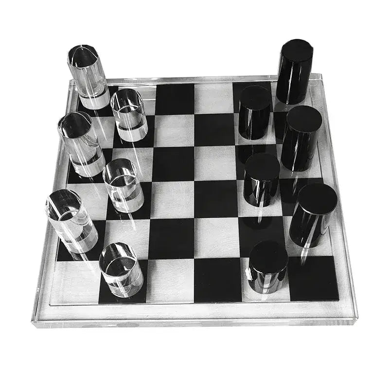 Modern geometric crystal chess set with transparent and black acrylic pieces on a sleek glossy board for living room decor