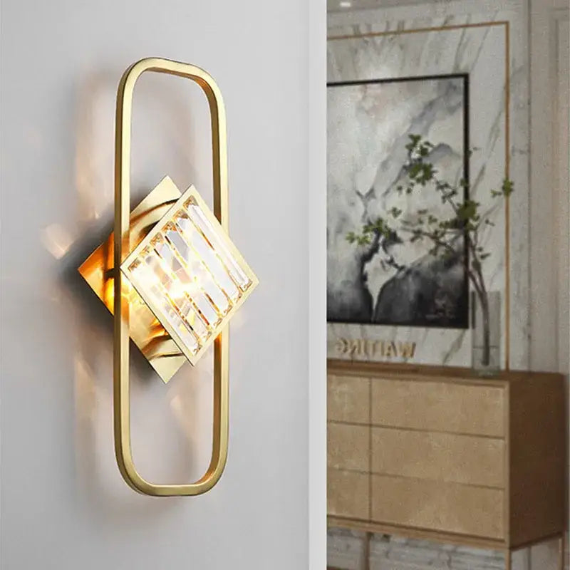 Gold-finished rectangular wall lamp with geometric design and clear crystal accents for decorbites crystal gold wall decor