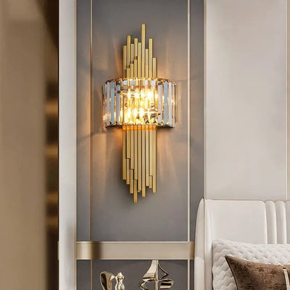 Gold-toned wall lamp with vertical crystal bars and central cylindrical glass shade for modern decorbites crystal gold wall decor