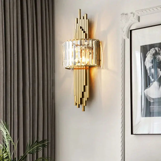 Modern geometric crystal gold wall lamp with vertical crystal accents in gold-toned metal for living room decorbites crystal gold