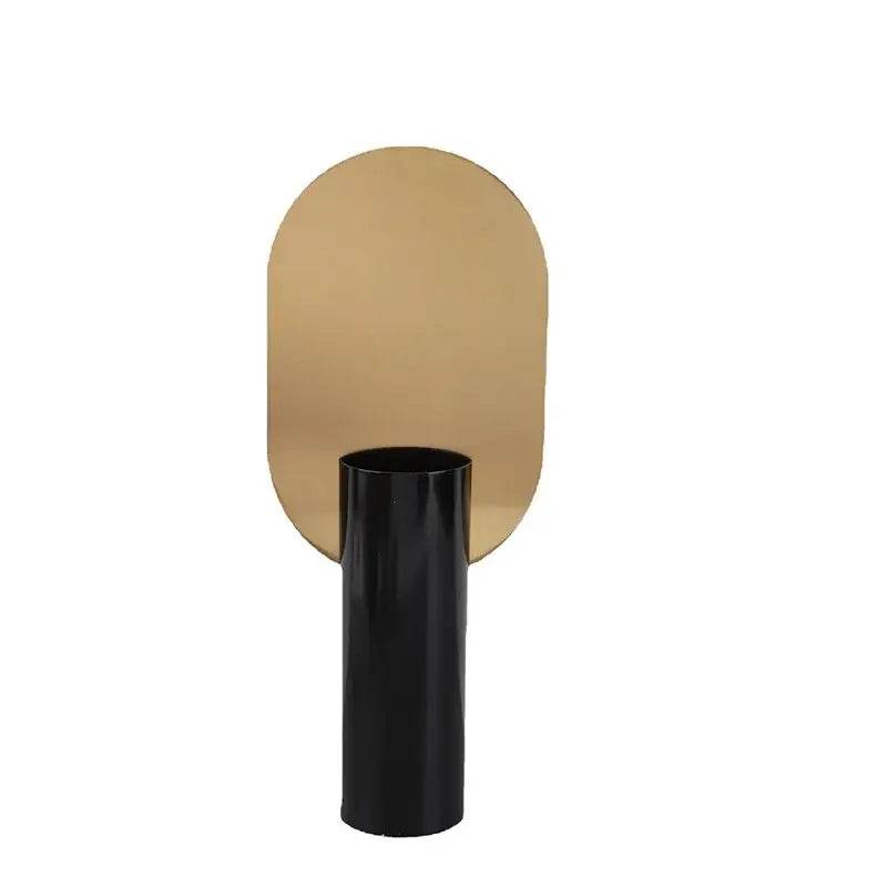 Modern geometric cylinder vase with pink artificial flowers featured next to a sleek black table lamp with gold backplate decorbites geometric cylinder vase decor
