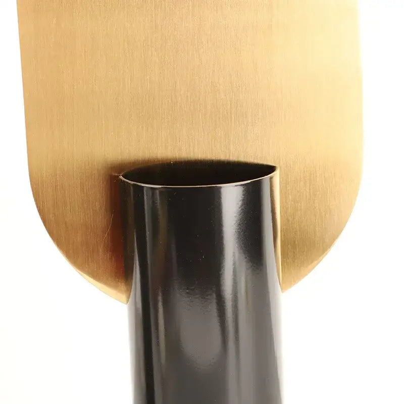Modern geometric cylinder vase in sleek black with a brushed gold backplate featuring pink artificial flowers decorbites geometric cylinder vase
