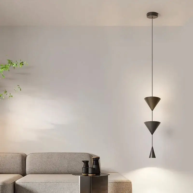Modern geometric decorbites cone long led pendant bedroom light with three stacked matte black conical shades suspended by thin cord