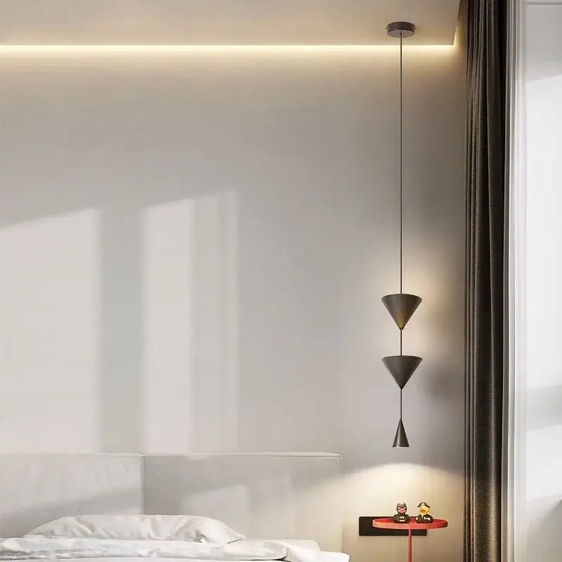 Modern black decorbites cone long led pendant light with sleek metallic finish and minimalist geometric design for bedroom use