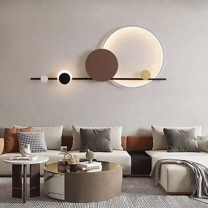 Modern geometric decorbites led wall sconce with sleek black bar and illuminated white brown gold circular lights for bedroom