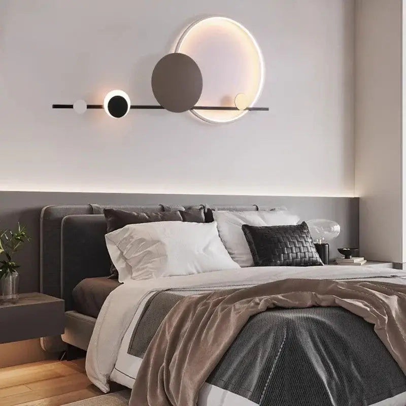 Modern geometric decorbites led wall sconce with black metal frame and three illuminated discs for bedroom atmosphere light