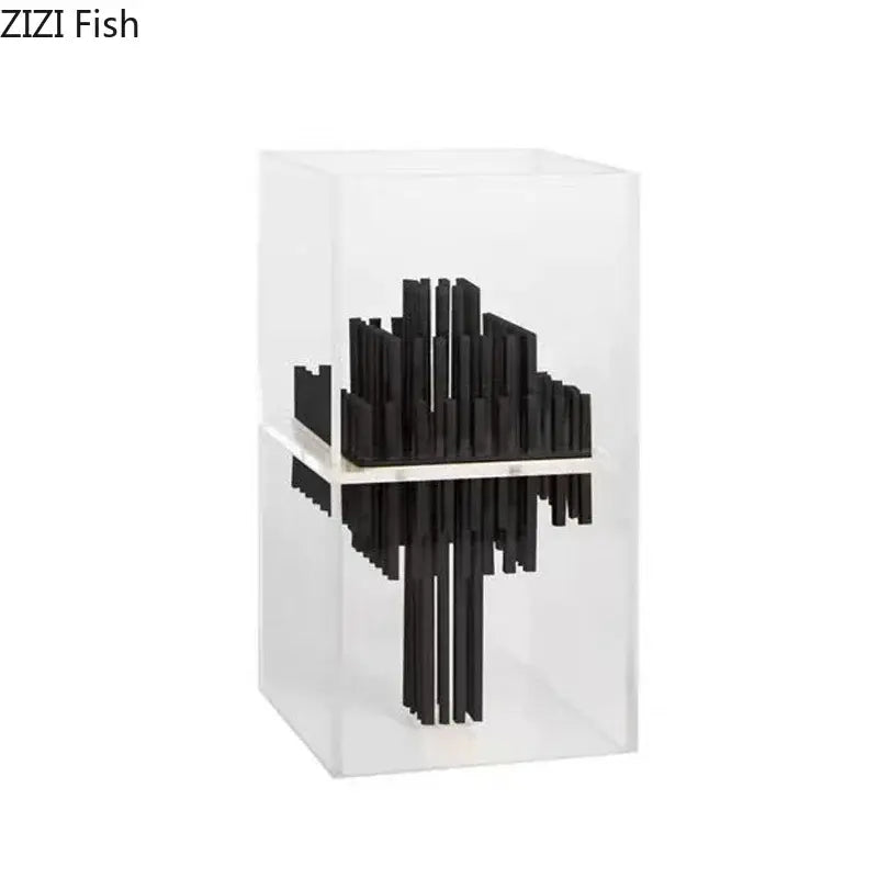 Black abstract fish sculpture made of acrylic rods inside a transparent geometric display box for modern living room decor