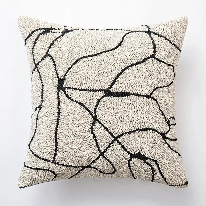 Cream-colored cushion cover with bold black abstract lines featuring decorbites geometric embroidered design for living room decor