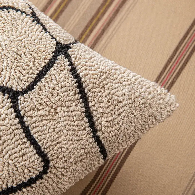Beige and black textured cushion cover with geometric embroidered pattern for modern living room decorbites decor