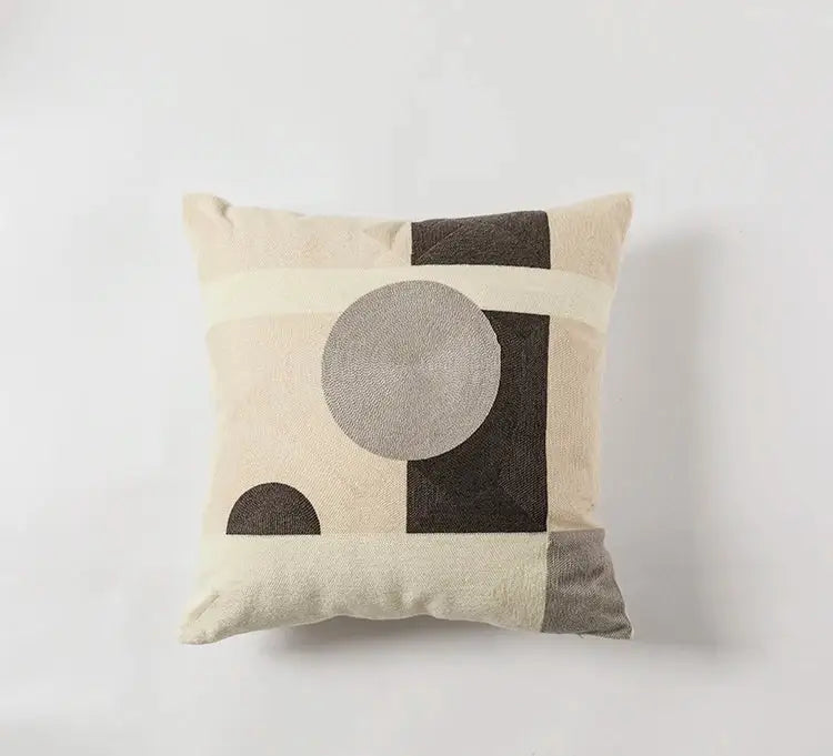 Beige and charcoal modern geometric embroidery cushion with textured circular design for living room decorbites decor