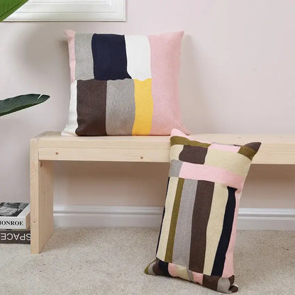 Modern geometric embroidery pillow cover in pastel pink beige and navy blue textured knit fabric for living room decorbites