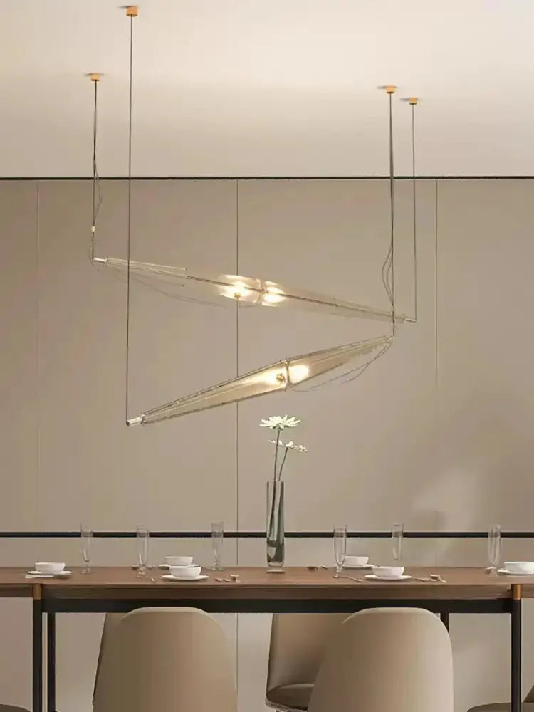 Modern geometric glass cone chandelier featuring a sleek angular glass cone and metal structure for dining room lighting