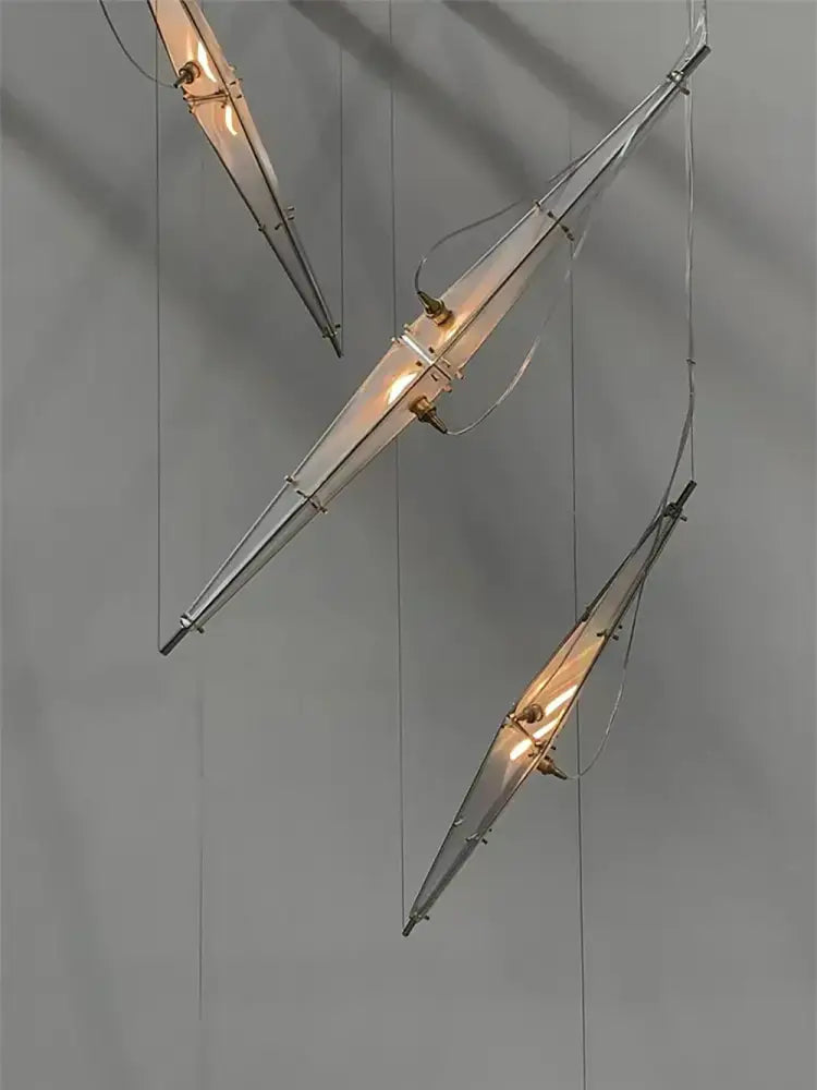 Modern geometric glass cone chandelier with sleek metallic frames and warm glass panels for dining room pendant lamp