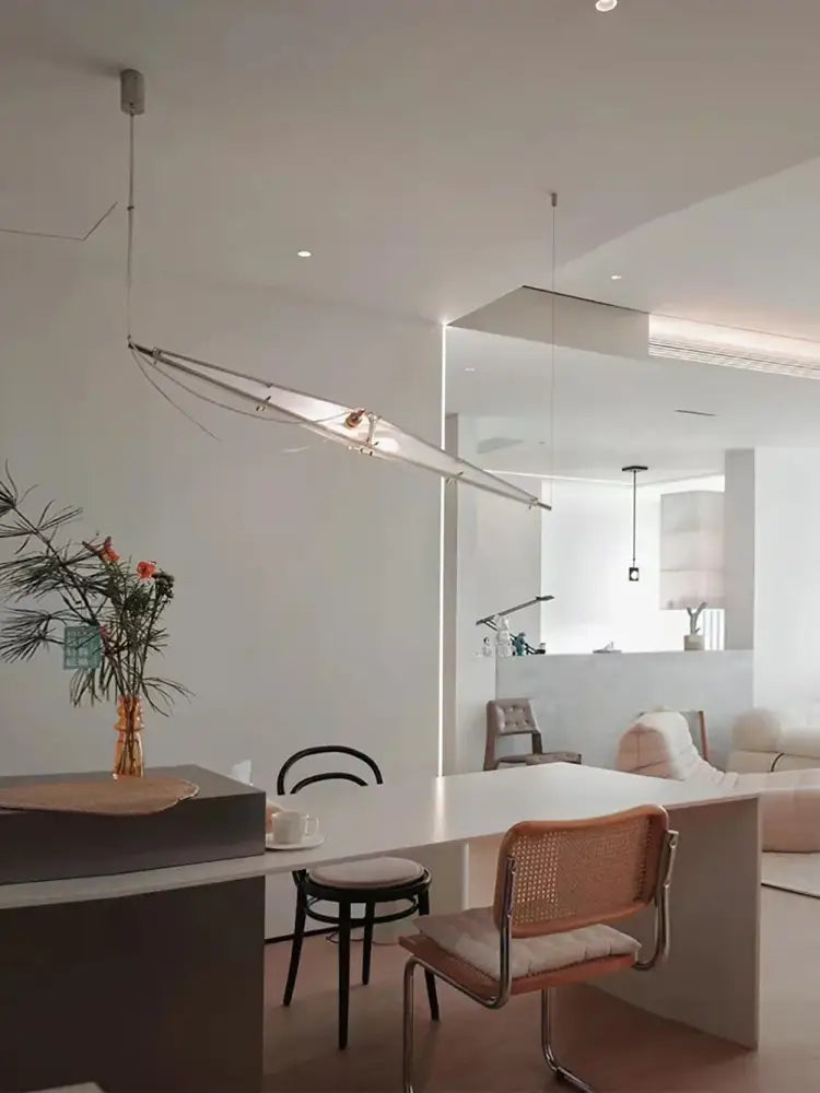 A sleek modern geometric glass cone chandelier pendant lamp with metallic frame and frosted glass diffuser for dining room