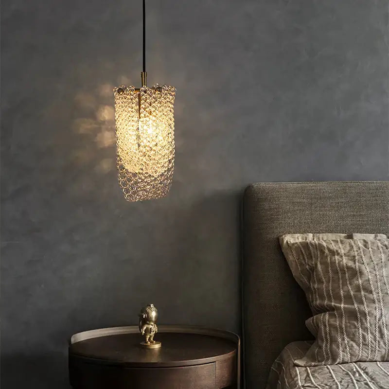 A warm golden modern geometric decorbites crystal led ceiling chandelier with clear textured glass cage for bedroom decor