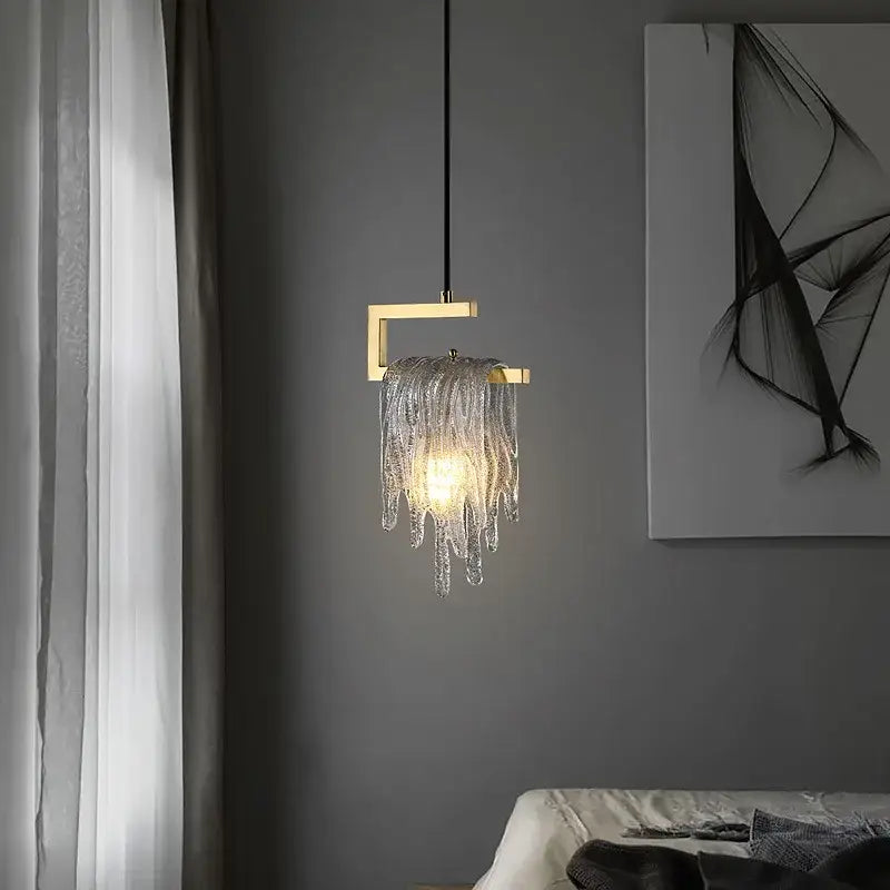 A modern geometric gold and clear crystal led ceiling chandelier with decorbites crystal led icicle elements for bedroom decor