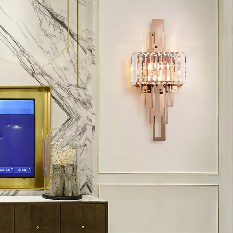 Modern geometric rose gold crystal wall lamp designed as a bedroom sconce for decorbites crystal wall decor