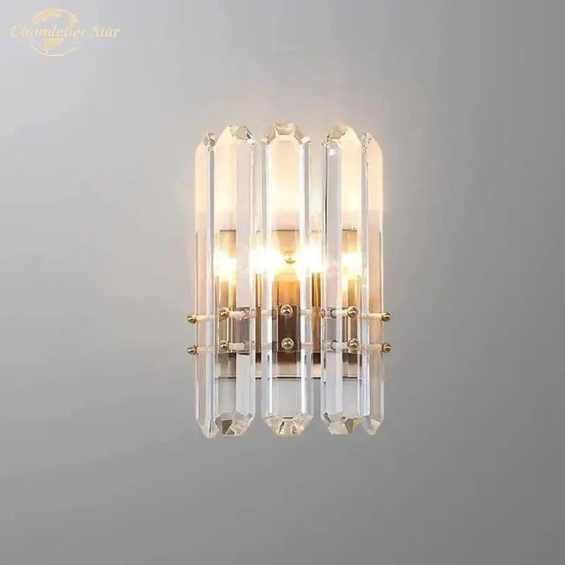 Modern geometric gold crystal wall sconce with five clear glass rods in a nordic wall sconce design for living rooms