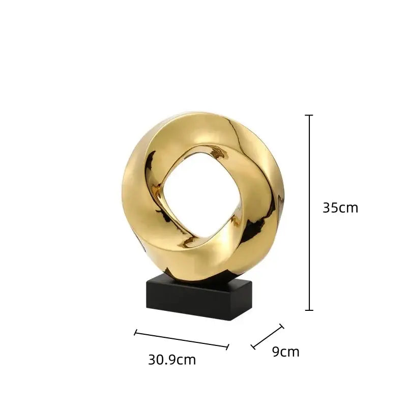 Modern geometric gold hollowed sculpture with sleek intertwined loop design on black base for home decor and decorbites geometric gold