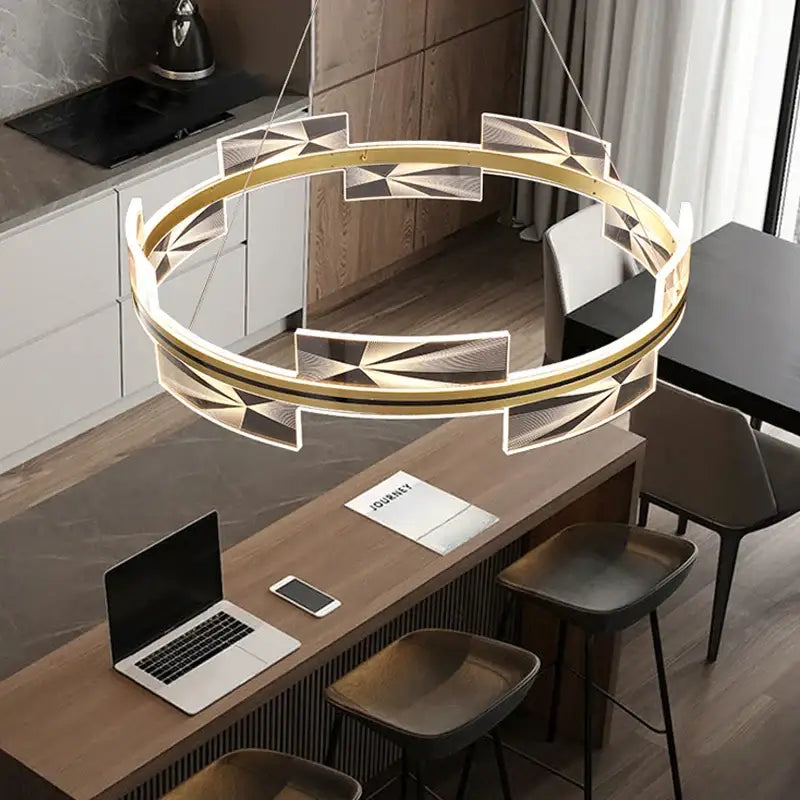 Modern gold led pendant light with geometric faceted panels and integrated leds for dining room decorbites gold led decor