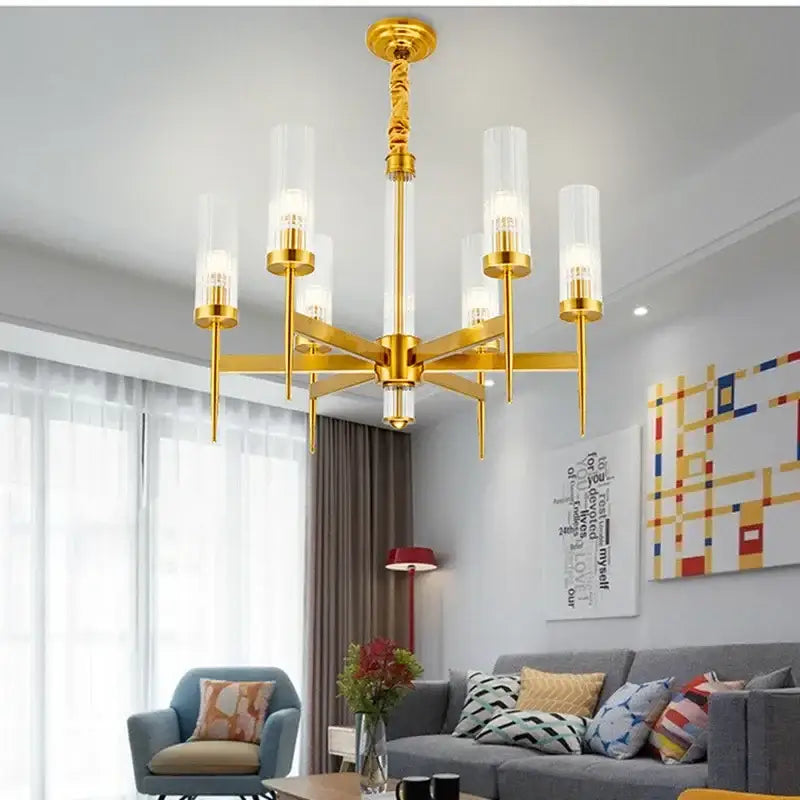 Modern geometric gold metal glass pendant light with six clear cylindrical shades and twisted gold metal stem decorbites gold metal