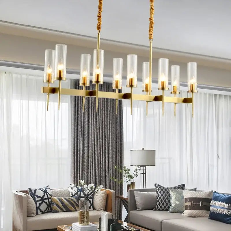 Modern geometric gold metal glass pendant light with gold-toned cylindrical glass shades for dining room decorbites gold metal