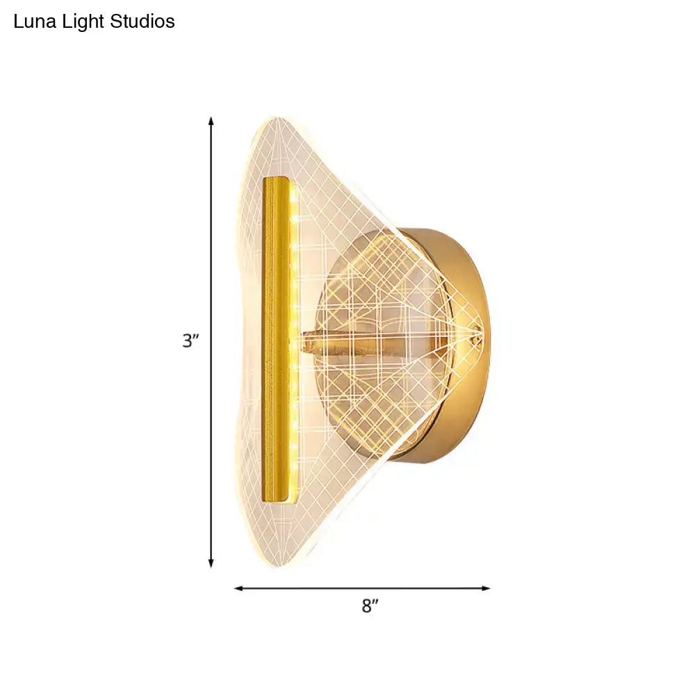 Modern geometric gold sconce light with a translucent diffuser and integrated led lighting for living room use