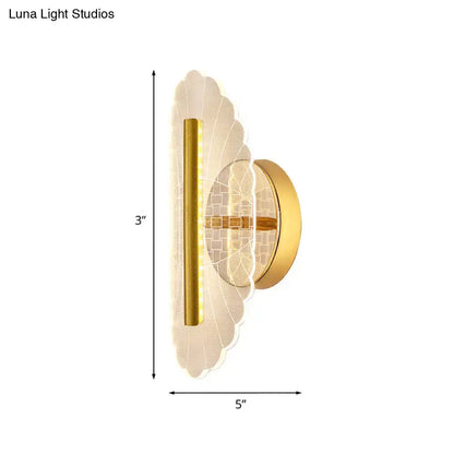 Modern geometric gold sconce light with a gold finish scalloped glass shade and vertical led strip for living room use